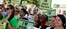 RRMC nurses and family members holding signs that say I heart RRMc nurses
